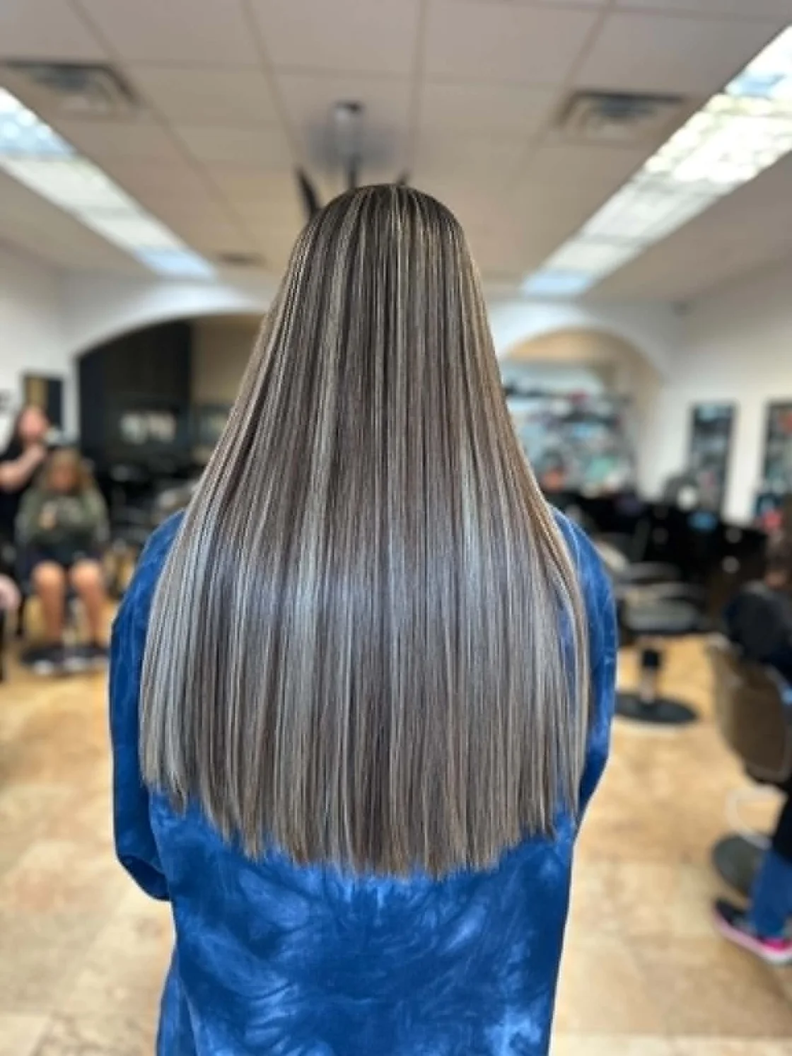 Soft blonde balayage and highlights by Tyra Hair Studio in Cypress, Texas